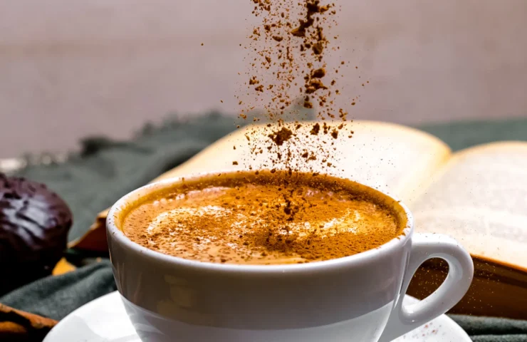 front-view-cup-cappuccino-with-cookies-book-table